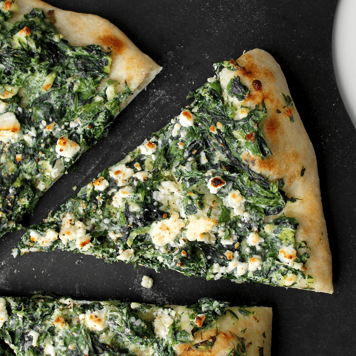 spanakopita pizza slice
