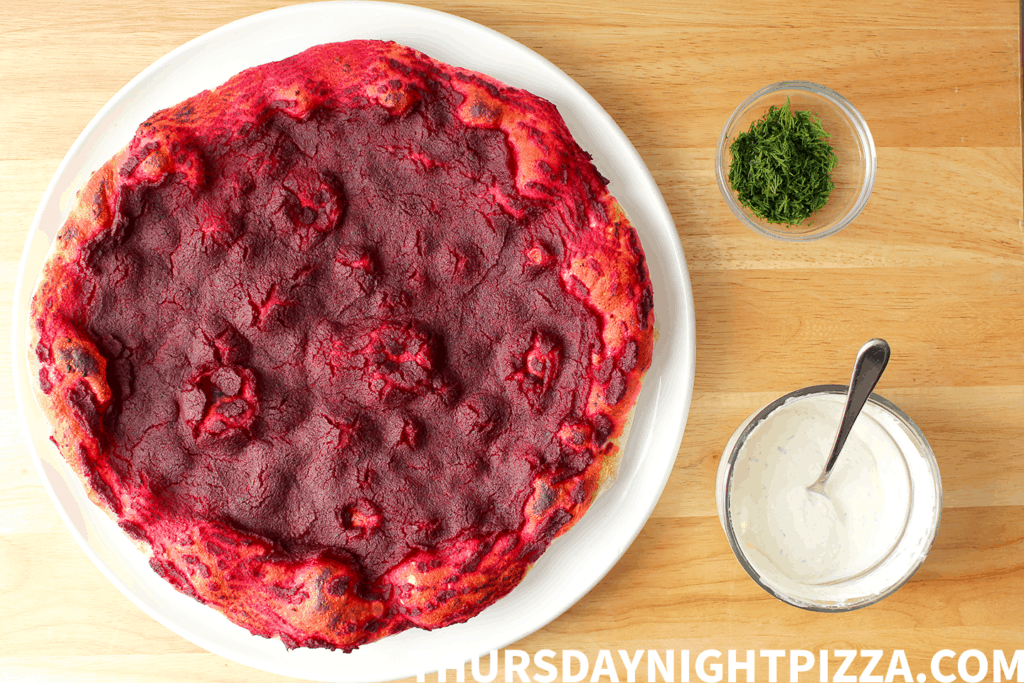 Borscht Pizza with beet puree, horseradish cream, and fresh dill