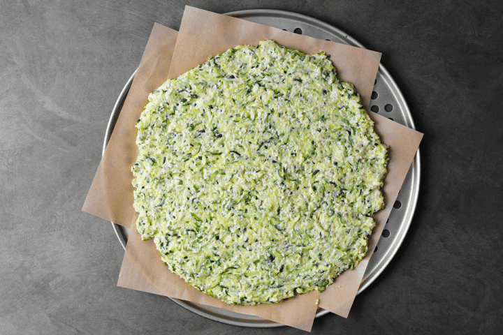 zucchini summer squash pizza dough on pan