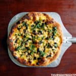 Moroccan-Inspired Pizza with Preserved Lemon, Olives, and Saffron Cream