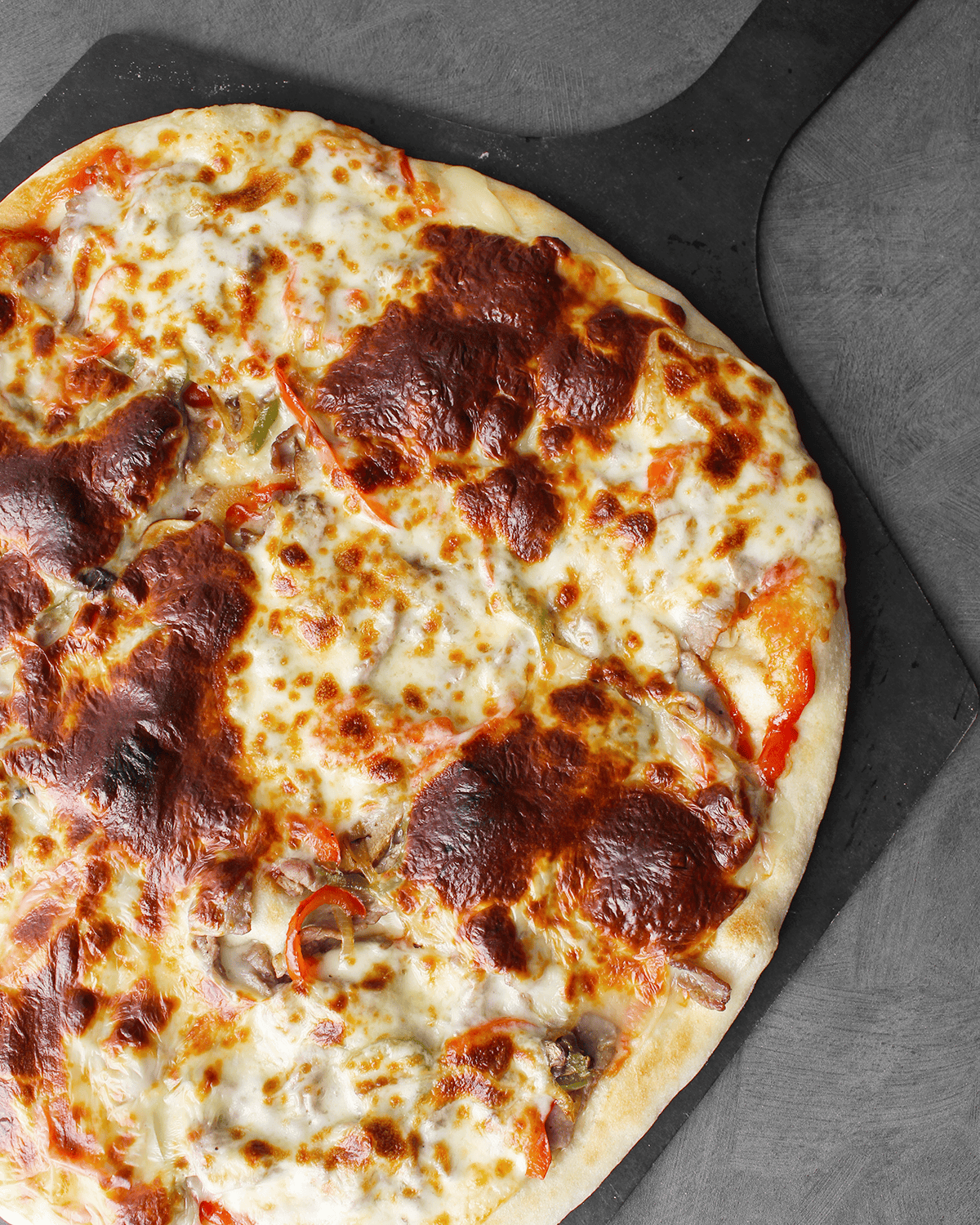 Cheese Steak Pizza with provolone and American cheeses, baked
