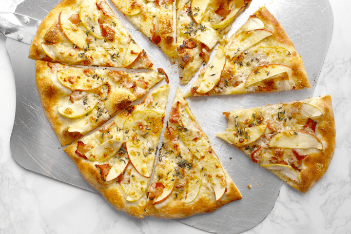 maple-bacon pizza on peel