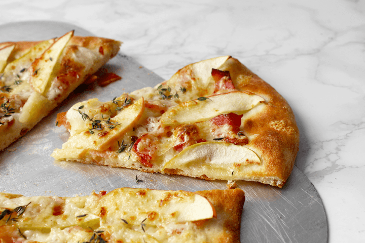 maple-bacon pizza slice, side view