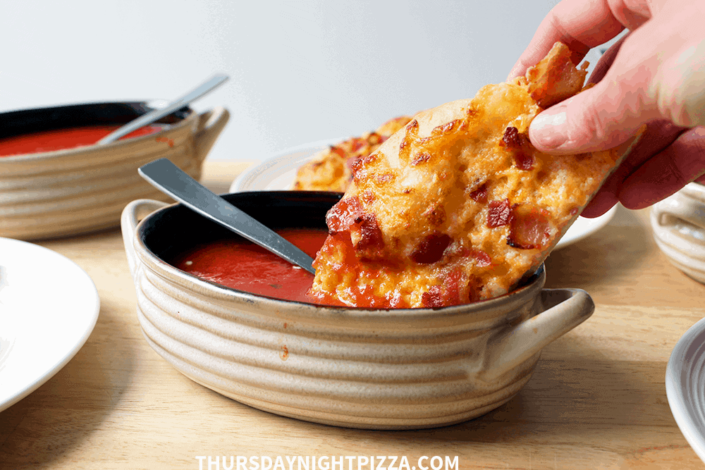 Dipping pizza in the soup