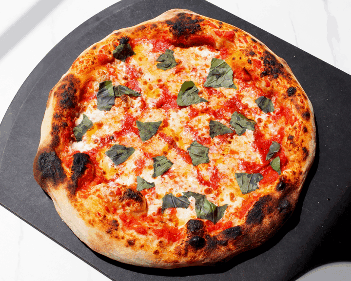 margherita pizza on pizza peel