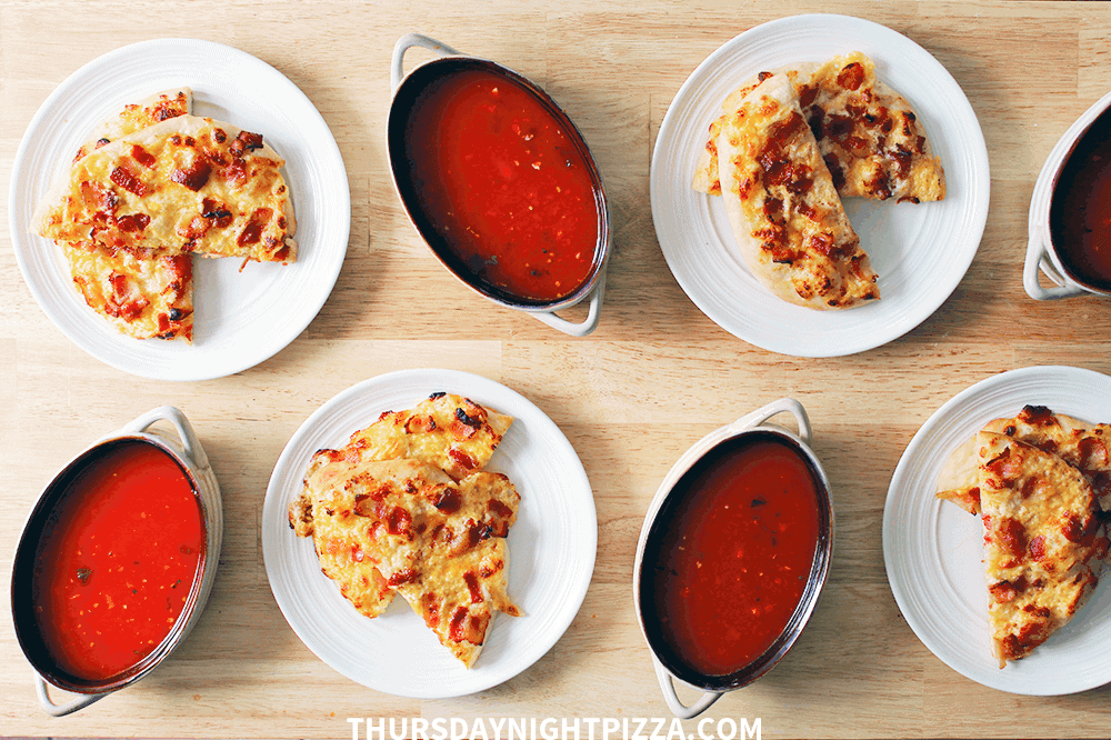 Individual servings of soup and cheese pizzas
