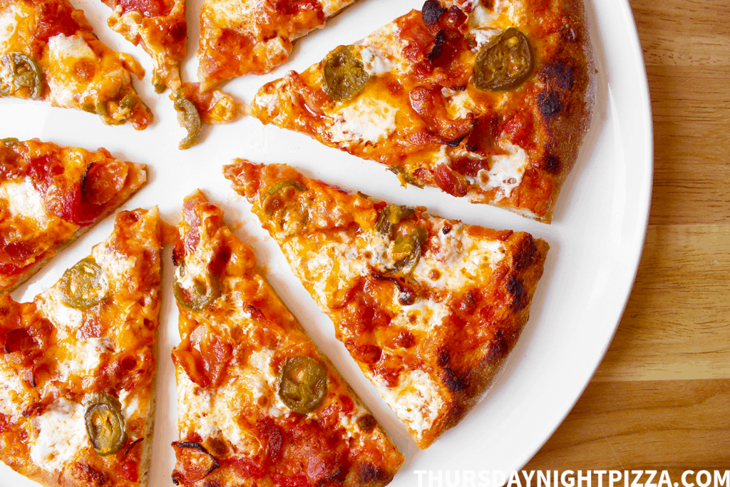 Close-up on slices of Bacon and Jalapeño Pizza
