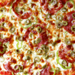 salami pizza with pepper, fennel, and olives