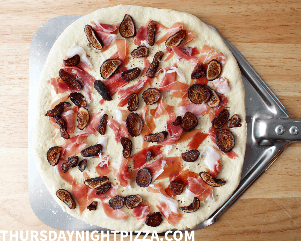 topping the pizza