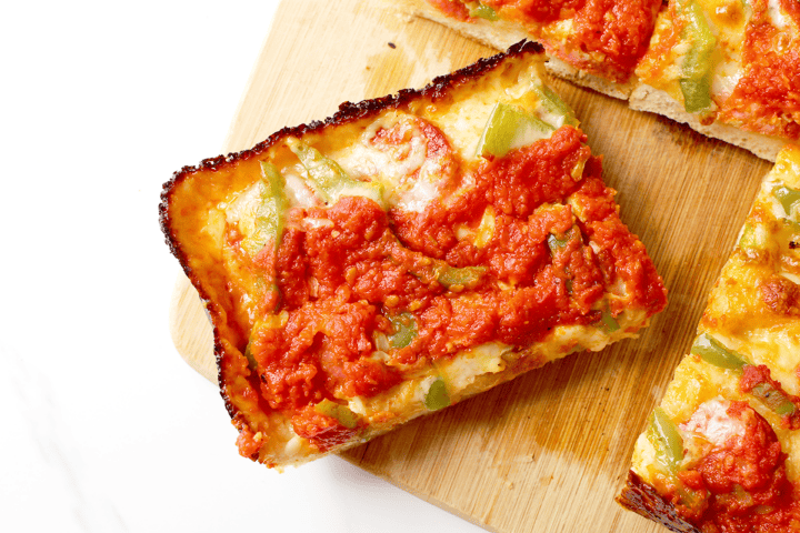 Detroit pizza with pepperoni and green bell peppers