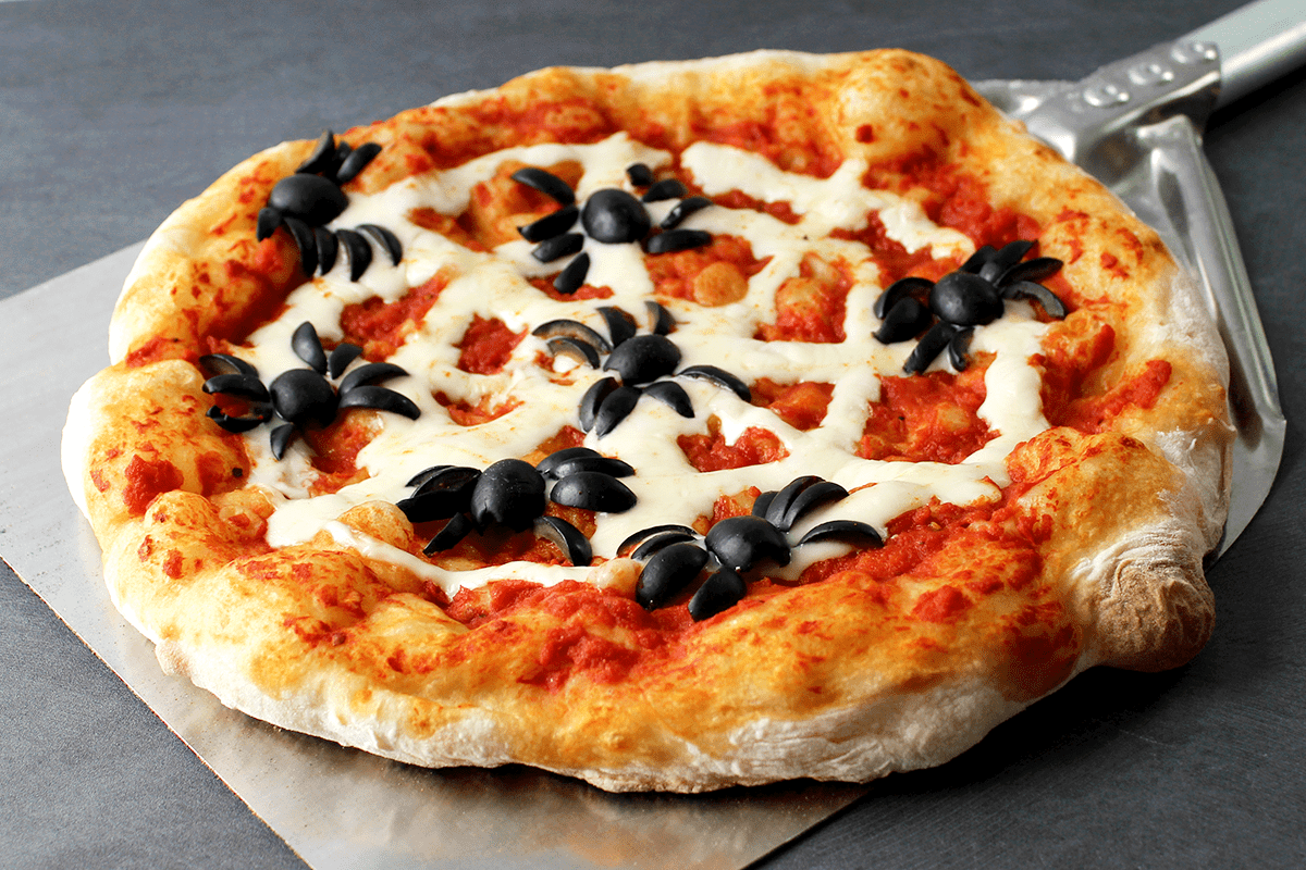 Thursday Night Pizza's Halloween pizza with olive spiders and string cheese web