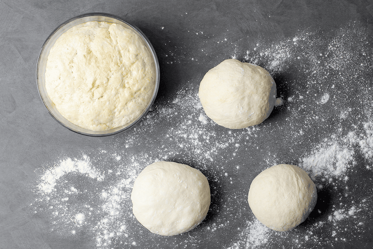 pizza dough balls on countertop
